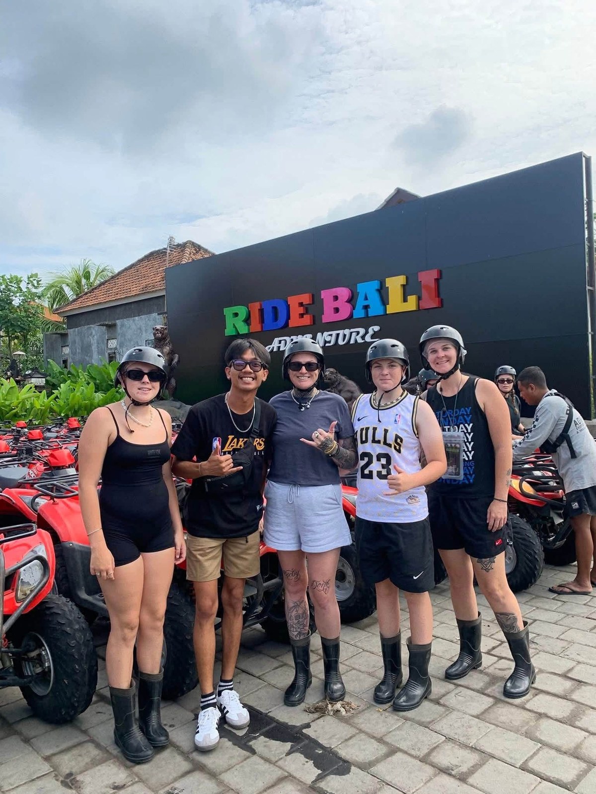 Group of guests with Adi Bali Driver after an ATV adventure