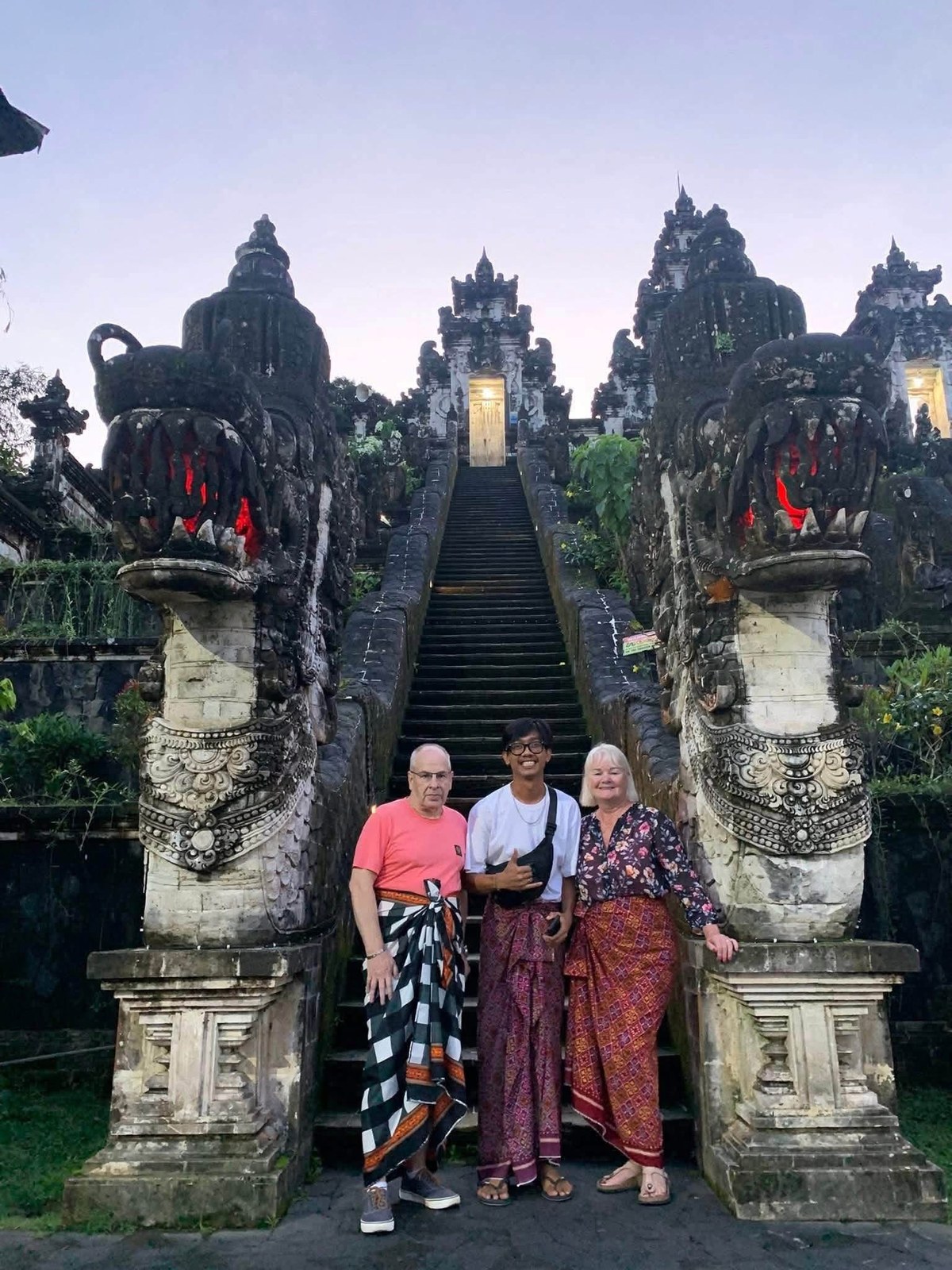 Guests with Adi Bali Driver at a Balinese temple