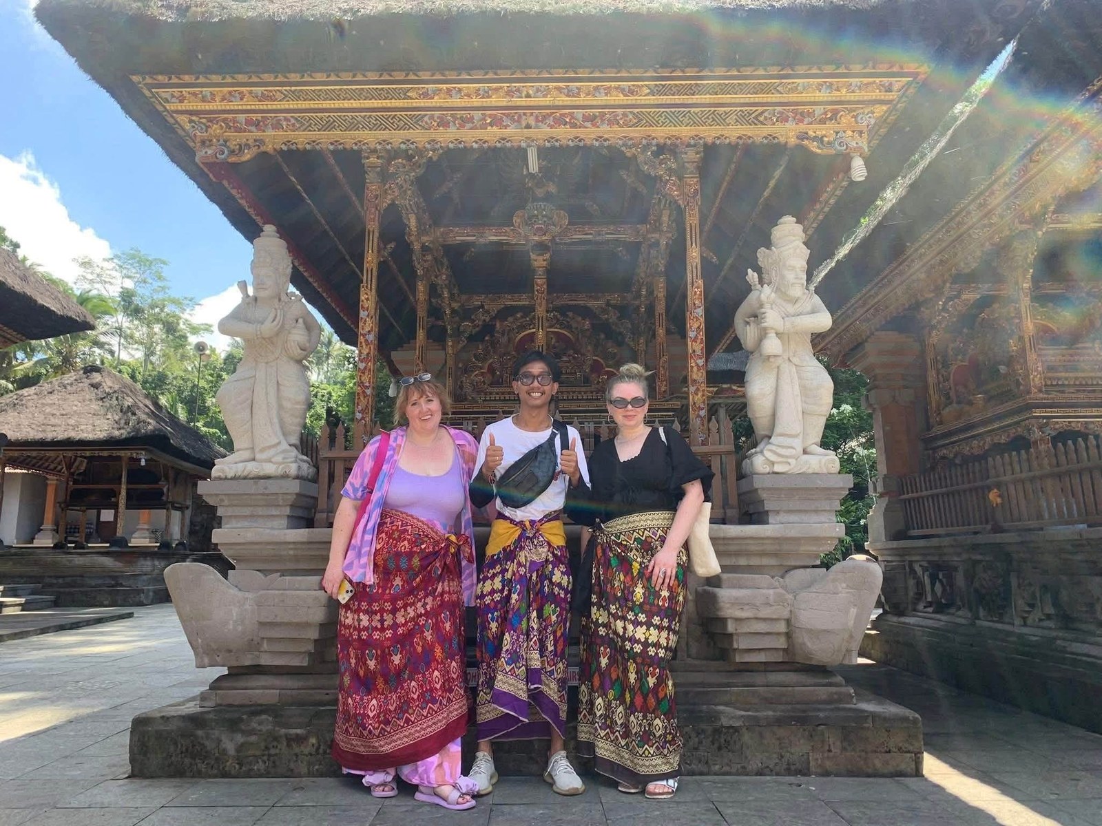 Guests with Adi Bali Driver at a traditional Balinese temple